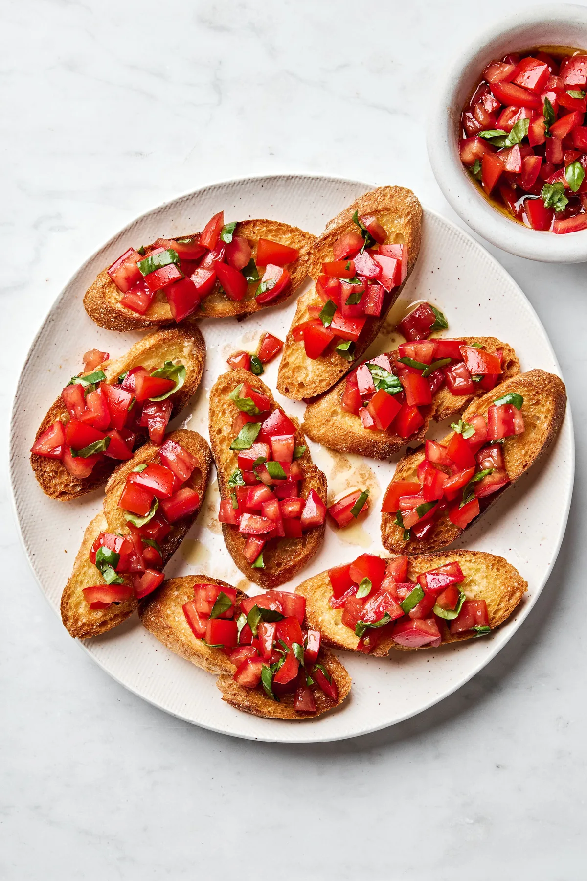 Easy homemade bruschetta recipe with fresh tomato, basil and garlic topping on grilled Italian bread