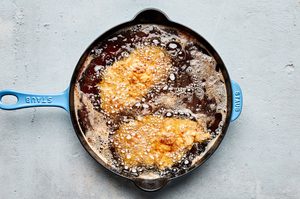 chicken fried chicken deep frying in oil to make the ultimate comfort food dinner