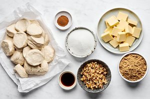 Ingredients prepped and laid out to make easy Monkey Bread with walnuts and vanilla