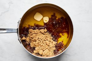 butter, brown sugar and vanilla being melted and combined into a smooth sweet buttery sauce to pour onto monkey bread