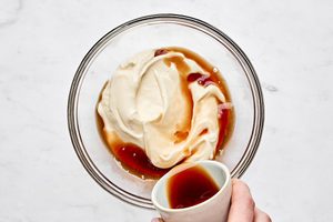 balsamic mayo being made in a bowl by mixing mayo and balsamic vinegar