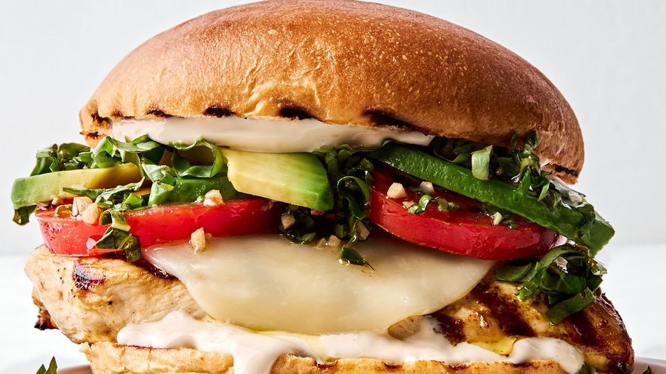 a grilled chicken sandwich with provolone, marinated tomatoes, balsamic mayo & avocado, the perfect summer sandwich
