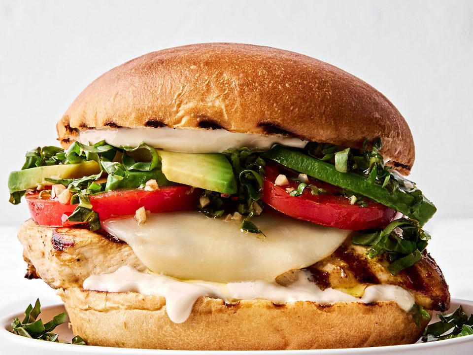 a grilled chicken sandwich with provolone, marinated tomatoes, balsamic mayo & avocado, the perfect summer sandwich