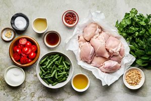 Flat lay of ingredients for Asian-inspired grilled chicken thighs with blistered green salad