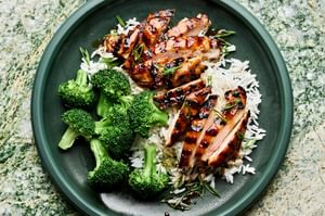 homemade grilled teriyaki chicken served on top of fluffy white rice with a side of steamed broccoli
