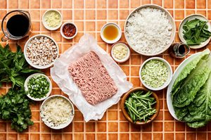 ingredients laid out to make a healthy low-cab ground turkey stir fry with cabbage, mushrooms, cauliflower rice & fresh herbs
