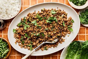 Healthy low-carb ground turkey stir fry made with cabbage & cauliflower rice served with white rice and lettuce leaves