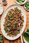 Ground turkey stir fry on a large platter made with cabbage, mushrooms, and cauliflower rice. A delicious low-carb dinner.