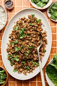 Ground turkey stir fry on a large platter made with cabbage, mushrooms, and cauliflower rice. A delicious low-carb dinner.