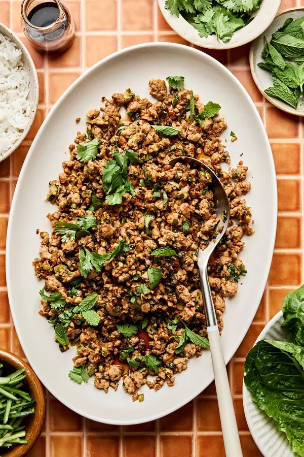Ground turkey stir fry on a large platter made with cabbage, mushrooms, and cauliflower rice. A delicious low-carb dinner.