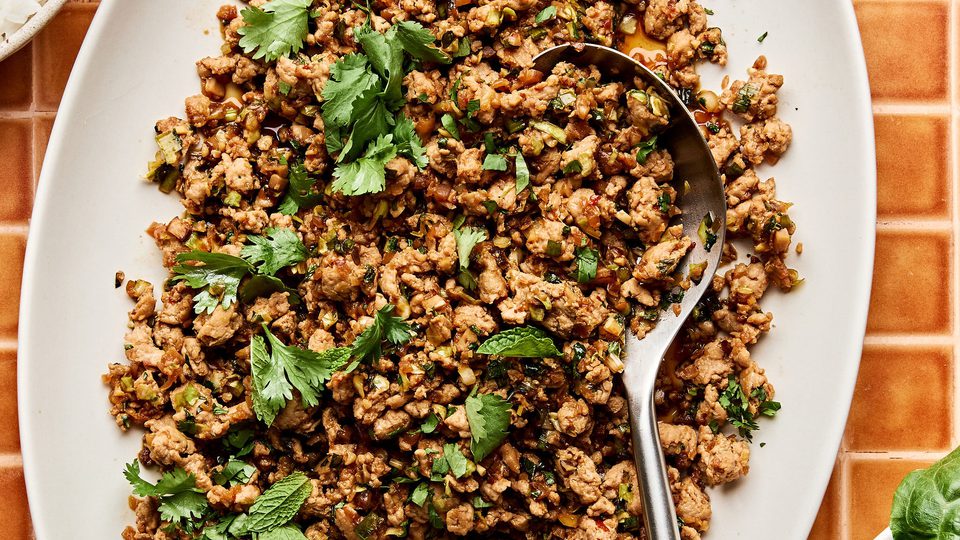 Ground turkey stir fry on a large platter made with cabbage, mushrooms, and cauliflower rice. A delicious low-carb dinner.
