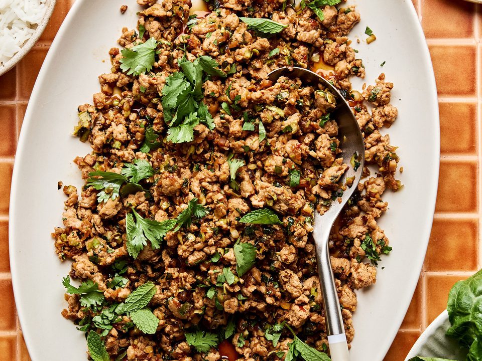 Ground turkey stir fry on a large platter made with cabbage, mushrooms, and cauliflower rice. A delicious low-carb dinner.