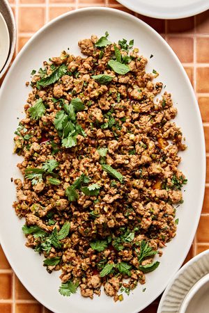 Ground turkey stir fry on a large platter made with cabbage, mushrooms, and cauliflower rice. A delicious low-carb dinner.
