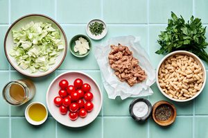 ingredients laid out to make a quick and easy sausage, cabbage and white bean skillet. A healthy one pan dinner.