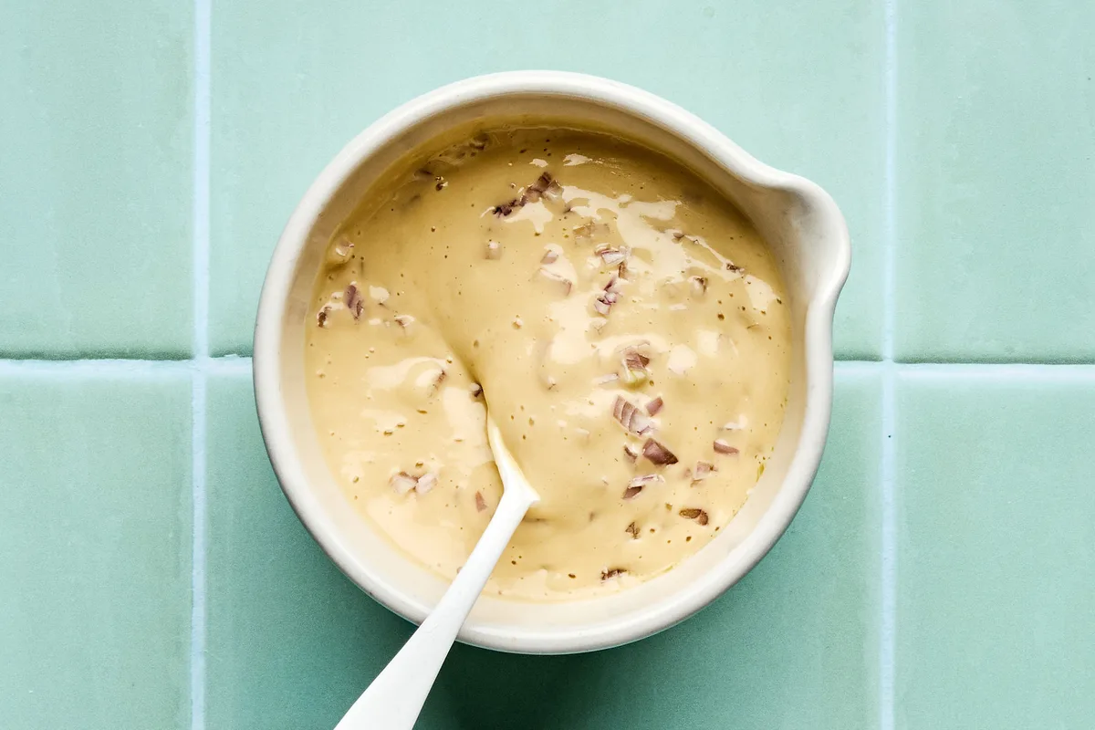 a bowl of homemade miso dressing to use for sesame chicken salad