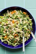 Bright sesame chicken salad with juicy orange slices and sliced almonds with a homemade miso dressing