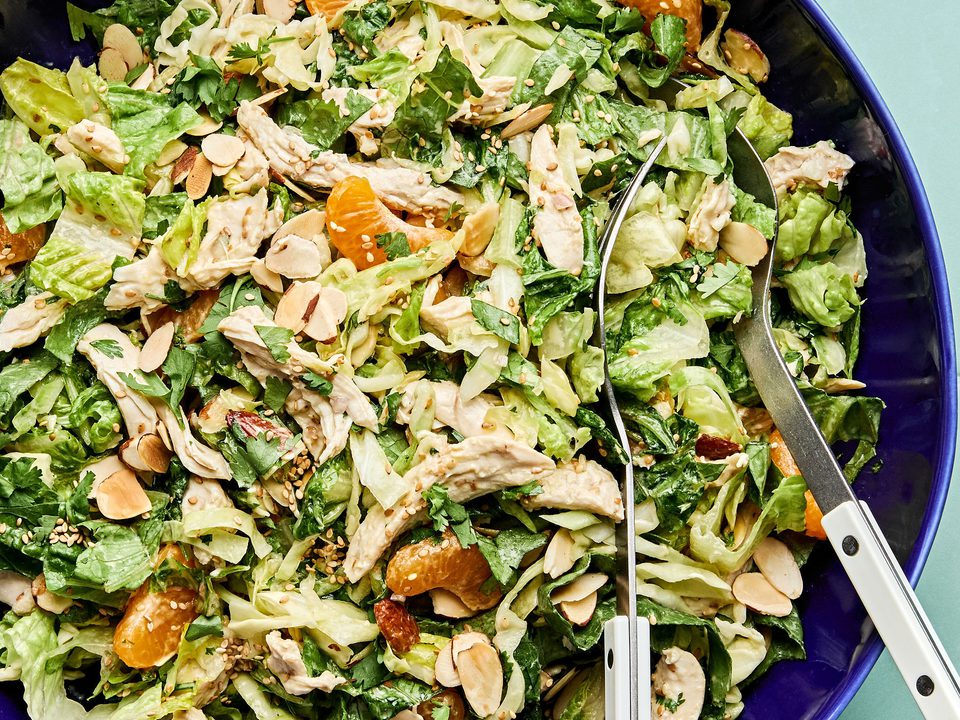 Bright sesame chicken salad with juicy orange slices and sliced almonds with a homemade miso dressing