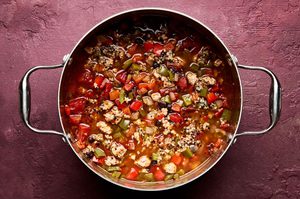 a pot of healthy and hearty southwest turkey & quinoa soup with black beans, bell peppers and fire roasted tomatoes