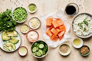 ingredients for teriyaki salmon bowls with wasabi dressing laid out and prepared on the counter