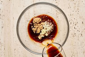 teriyaki marinade being mixed in a bowl to use for teriyaki salmon bowls with wasabi dressing
