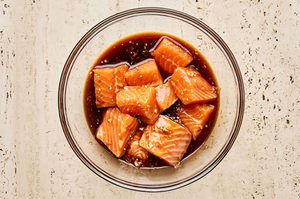salmon pieces marinating in homemade teriyaki sauce to be used in teriyaki salmon bowls with wasabi dressing