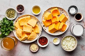 ingredients laid out to make a pot of cozy pumpkin soup with asian Thai flavors