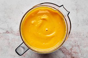 Thai pumpkin soup mixing in a blender until smooth