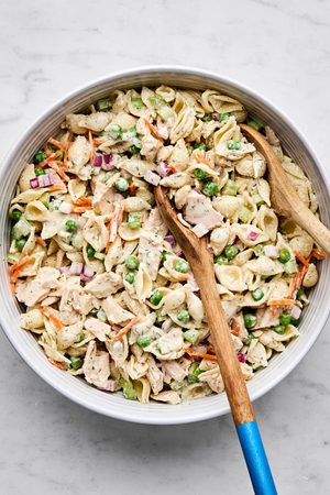 A bowl of homemade tuna pasta salad with celery, red onion, and carrots. Perfect for summer lunches, meal prep, or potlucks.