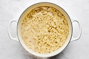 pasta being cooked in salted water to make tuna pasta salad a perfect dish for picnics and potlucks