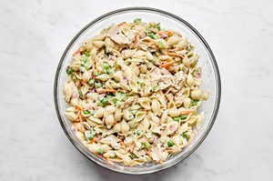 A bowl of homemade tuna pasta salad with celery, red onion, and carrots. Perfect for summer lunches, meal prep, or potlucks.