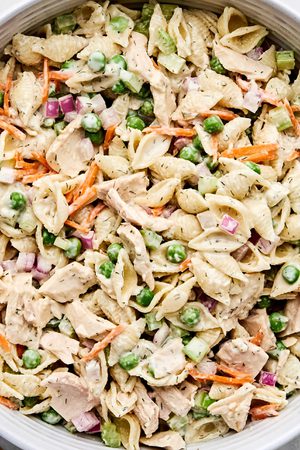 A bowl of homemade tuna pasta salad with celery, red onion, and carrots. Perfect for summer lunches, meal prep, or potlucks.