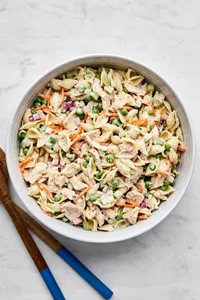 A bowl of homemade tuna pasta salad with celery, red onion, and carrots. Perfect for summer lunches, meal prep, or potlucks.
