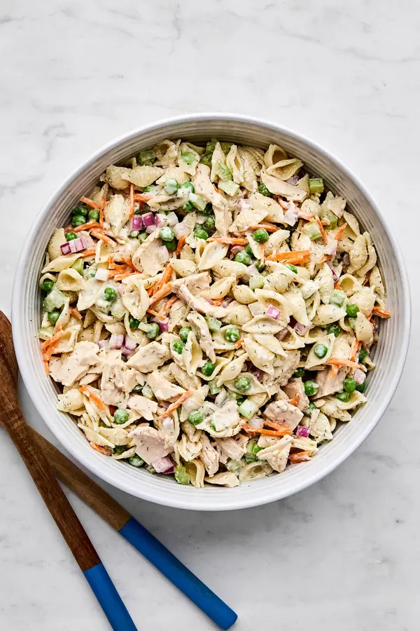 A bowl of homemade tuna pasta salad with celery, red onion, and carrots. Perfect for summer lunches, meal prep, or potlucks.