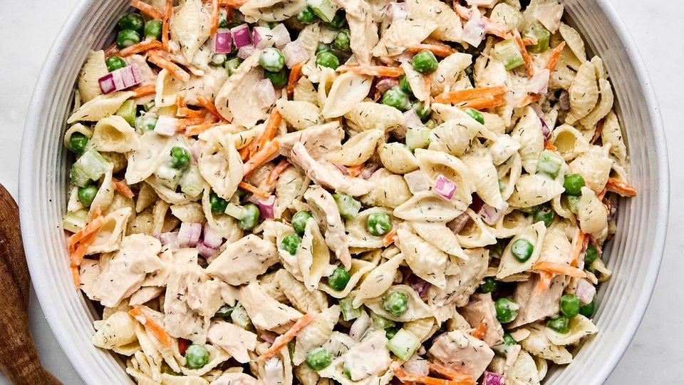 A bowl of homemade tuna pasta salad with celery, red onion, and carrots. Perfect for summer lunches, meal prep, or potlucks.