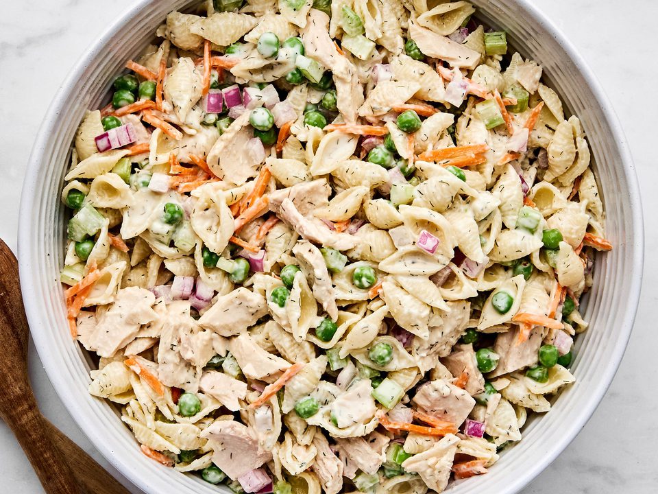 A bowl of homemade tuna pasta salad with celery, red onion, and carrots. Perfect for summer lunches, meal prep, or potlucks.