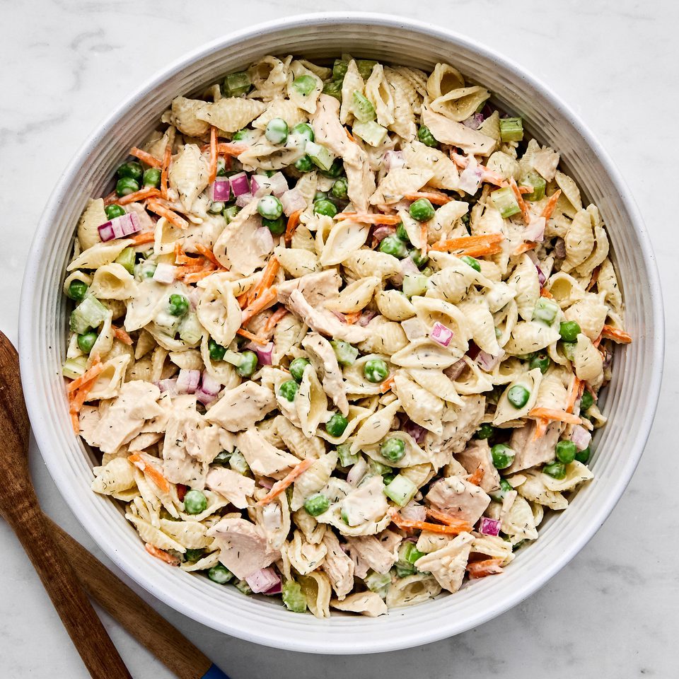A bowl of homemade tuna pasta salad with celery, red onion, and carrots. Perfect for summer lunches, meal prep, or potlucks.