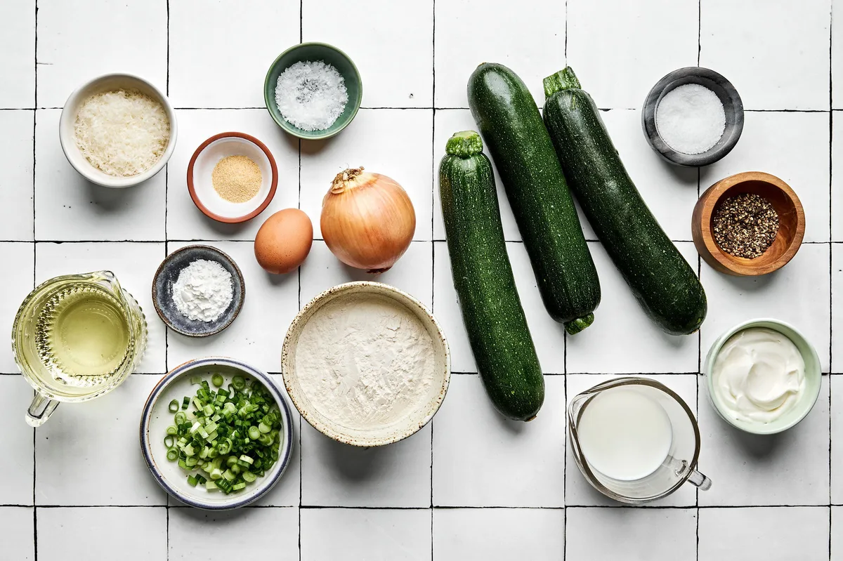 ingredients laid out and arranged on a counter to make zucchini fritters