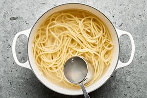 spaghetti noodles cooking a pot of salted boiling water