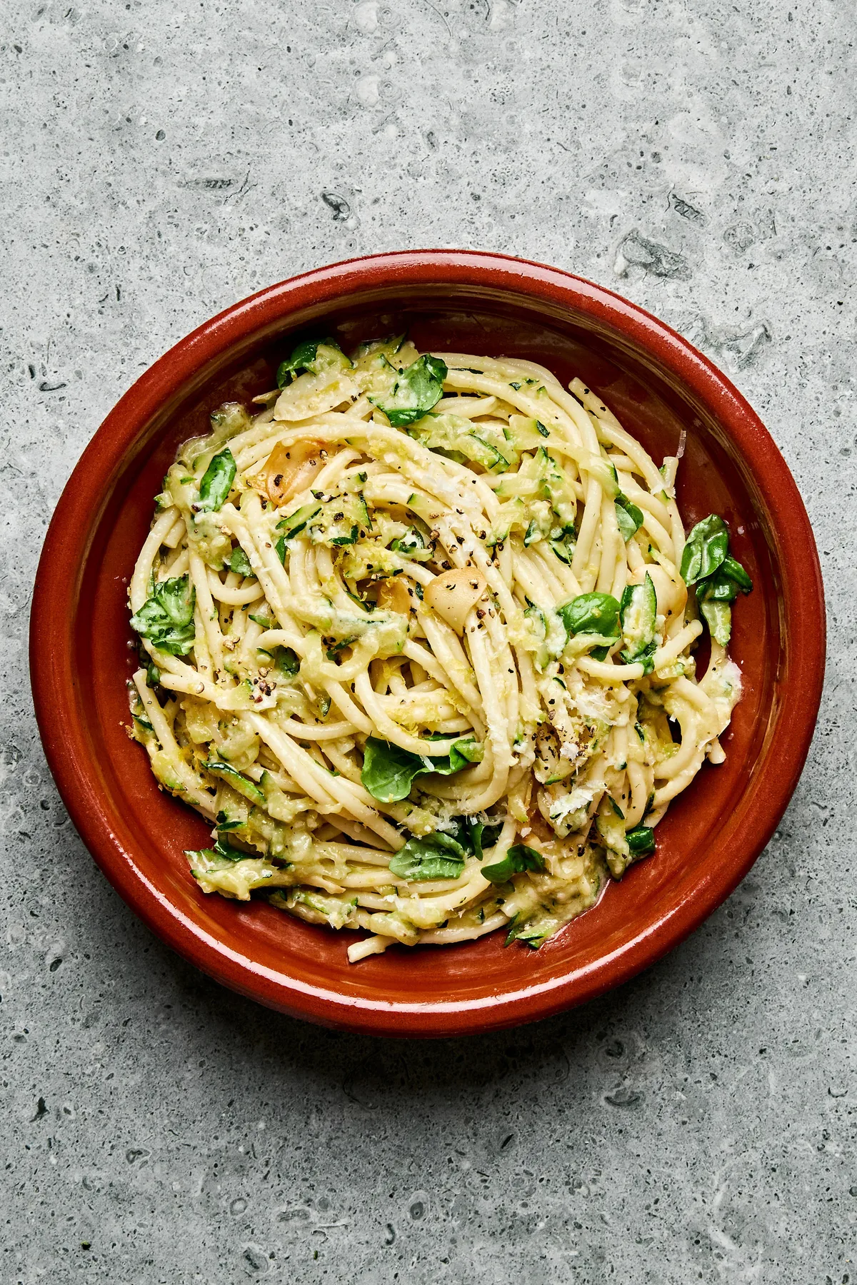 a bowl of zucchini pasta made with Spaghetti noodles coated in a creamy Parmesan zucchini sauce