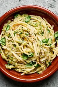 a bowl of zucchini pasta made with Spaghetti noodles coated in a creamy Parmesan zucchini sauce