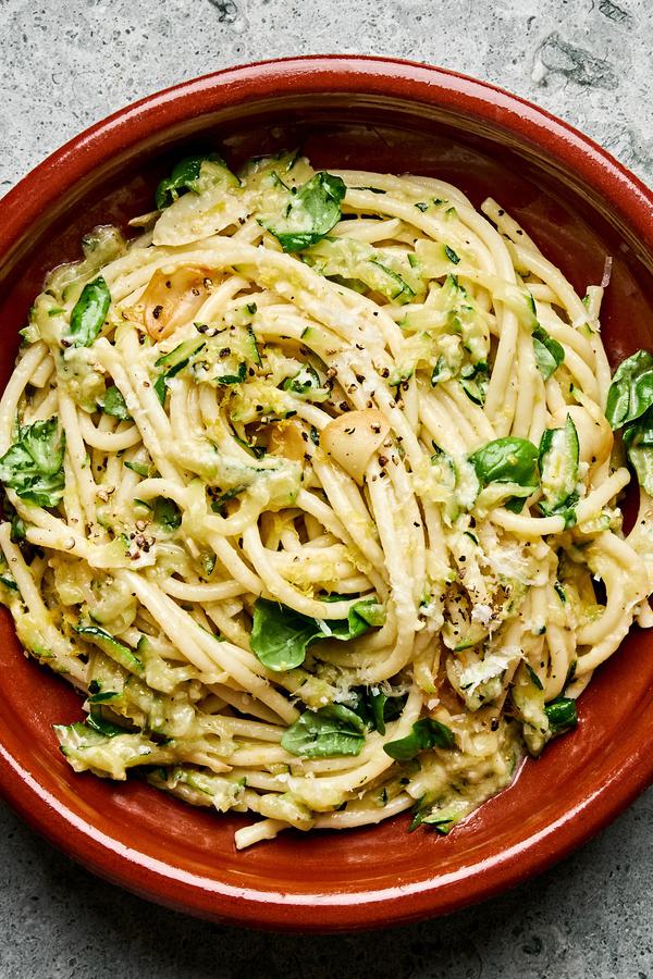 a bowl of zucchini pasta made with Spaghetti noodles coated in a creamy Parmesan zucchini sauce