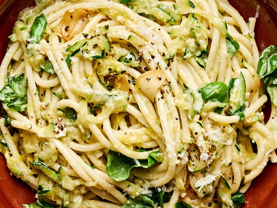 a bowl of zucchini pasta made with Spaghetti noodles coated in a creamy Parmesan zucchini sauce