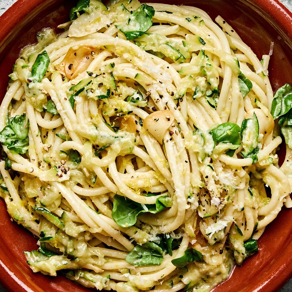 a bowl of zucchini pasta made with Spaghetti noodles coated in a creamy Parmesan zucchini sauce