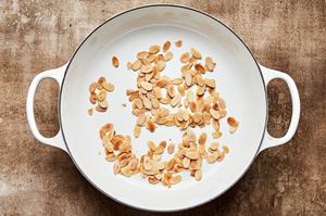 sliced almonds toasted in a skillet