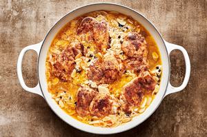 Almond and Currant Pilaf with Chicken being cooked in a skillet