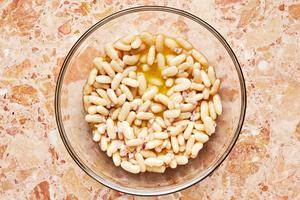 drained canned white beans tossed in a vinaigrette made of olive oil, lemon juice, mustard, sugar, shallots and salt