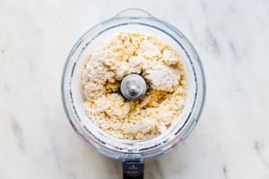 butter, flour, baking soda, baking powder and cheddar cheese pulsed in the base of a food processor
