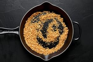panko being toasted in butter in a skillet