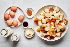 challah bread, eggs, butter, cream, milk, vanilla and cinnamon in prep bowls to make baked french toast