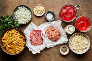 ground italian sausage, mostaccioli, ground beef, marinara, cream, mozzarella, spices, onion and parsley in prep bowls